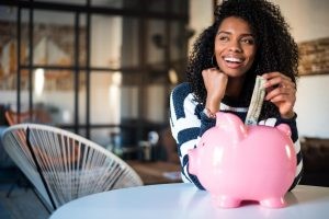 Woman-With-Piggy-Bank